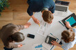 © Konstantin Yuganov - Business Team Collaboration Over Financial Charts and Data Analysis