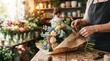 © Matheus - Closeup of florist preparing a beautiful mixed flower bouquet in a flower shop
