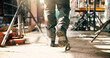 © peopleimages.com - Boots, person and walking at construction site for renovation, contractor and inspection of building progress. Foreman, engineering and shoes for remodel, infrastructure upgrade or project management