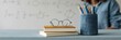 © Iryna - Glasses notebooks pencil study classroom composition with round eyeglasses on stacked books and pencil holder for education background and poster design
