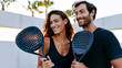 © dinatychynska - Padel lifestyle scene showing stylish couple after court play, highlighting luxury sportswear, social connection, modern fitness culture, romance, wellness, and premium club leisure.
