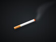 © Monad Nomad - Lit cigarette with burning tip and rising smoke on isolated dark background
