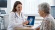 © Лена Федотова - Doctor explaining arthritis treatment to senior patient using digital tablet. Medical professional discussing joint health with elderly woman via i...