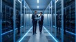 © Artem Zatsepilin - two caucasian it professionals walking in modern data center, man and woman looking at tablet. cloud computing, server maintenance, network security concept. banner, website header with copyspace.