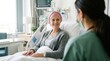 © FikriVisuals - Courageous senior cancer survivor wearing pink headscarf smiles during consultation with nurse in clinic, representing professional medical support, compassionate healthcare services, and patient hope