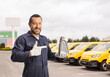 © Ljupco Smokovski - Vehicle mechanic holding engine oil bottle