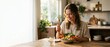 © Yuyun - Happy Young Woman Enjoying a Fresh and Healthy Salad for Lunch at Home.