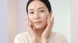 © R.Fauzi - Portrait of a young Asian woman with flawless glowing skin practicing a daily skincare routine for a healthy complexion