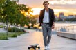 © YouraPechkin - Stylish individual walking with skateboard during sunset in urban park setting