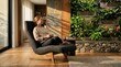 © Chainarong - A calm young woman sitting peacefully in a comfortable armchair within a sunlit modern home interior featuring lush indoor plants