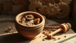 © 222 - Ancient terracotta pot containing resin pieces with grinding tools, warm lighting.