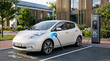 © Luiz - Electric Vehicle Charging Station: A white electric car is plugged into a charging station, symbolizing a commitment to sustainable transportation and a greener future.