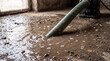 © Tsalsa - Industrial pump hose extracting dirty flood water from concrete basement floor.