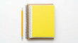 © Creative Valley - Flat lay of spiral notebook with bright yellow cover beside pencil on white background illustrating back to school, study materials, education, classroom readiness, writing and organization