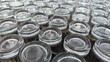 © Maule - High angle view of empty clear drinking glasses arranged upside down in neat rows on a textured surface, perfect for catering, restaurant, or banquet service concept.