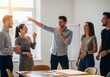 © NURUNNAHAR - Group of diverse young professionals laughing and collaborating in a bright office