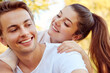 © Westend61 - Happy young couple at a park hugging each other