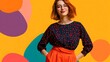 © Thares2020 - A young woman with red hair and glasses smiles confidently against a vibrant abstract background of bold orange  purple  and teal shapes