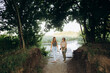 © dsheremeta - Female friends walking, talking in nature
