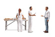 © Ljupco Smokovski - Physiotherapist or masseur talking to a male customer in a clinic
