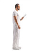 © Ljupco Smokovski - Health practitioner standing in profile with clipboard