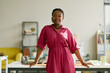 © Seventyfour - Portrait of young African American businesswoman standing at desk in office, looking at camera and presenting confident leadership. Ideal for workplace branding, career growth campaigns