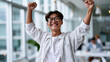 © Nataliya - Portrait of successful business owner male boss Asian cheerful happy smiling and rejoicing in modern office by big window, entrepreneur success concept, corporate portrait