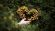 © TensorSpark - Hand holding a heart shaped flower cluster in lush foliage, symbolizing love, nature care, eco harmony and mindful lifestyle.