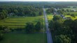 © Steve Tanner Stock - Early morning in Tennessee countryside with country road and homes in rural America beside green pastures and farmland