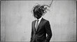 © Mudakir - Businessman with tangled wire head, abstract concept of stress and confusion