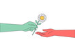 © David Indranata - Hand giving a daisy flower as a gesture of kindness and empathy