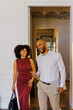 © BONNINSTUDIO/Stocksy - Professionals having fun while arriving at office building