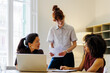 © BONNINSTUDIO/Stocksy - Colleagues collaborating on business ideas during meeting