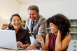 © BONNINSTUDIO/Stocksy - Professionals collaborating during office teamwork