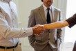 © BONNINSTUDIO/Stocksy - Business partners shaking hands making a new deal