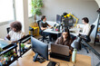 © Nunez Image SL/Stocksy - Diverse startup team working in a modern office