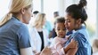 © Bonsales - Nurse giving vaccination to a young mother carrying her baby. Focus on preventive care and family health at a medical center