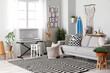 © Pixel-Shot - Interior of stylish living room with surfboard, synthesizer and sofa