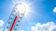 © AucArtStudio - Heat wave summer crisis thermometer under bright sun blue sky concept. Extreme heatwave weather. urban climate warming drought, hot sun temperature