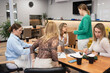 © svetograph - Businesswomen meeting office discussing project data during a corporate brainstorming session