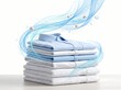 © nightowl studio - Stack of fresh clean folded shirts with blue wave breeze swirl concept for fabric softener and detergent advertisement