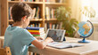 © Umar - Young boy in light blue t-shirt engaged in online learning on a tablet with teacher, concept for education, e-learning and remote studying