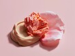 © Alper AI - Soft focus beauty product textures with delicate pink petal on pastel background