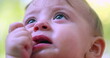 © Marco - Closeup of baby infant boy face having a tantrum crying displeased and upset