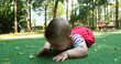 © Marco - Cute baby boy in outdoor park discovering the world grabbing leaf