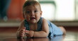 © Marco - Cute baby boy smiling to camera crawling at home