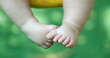 © Marco - Cute baby infant boy closeup legs and foot outside