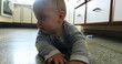 © Marco - Casual authentic baby home scene at kitchen floor