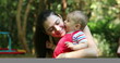 © Marco - Casual interaction between mother and baby infant son relationship outside smiling and happy