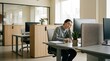 © Sarjuni - Woman Exhausted At Desk In Modern Office Setting